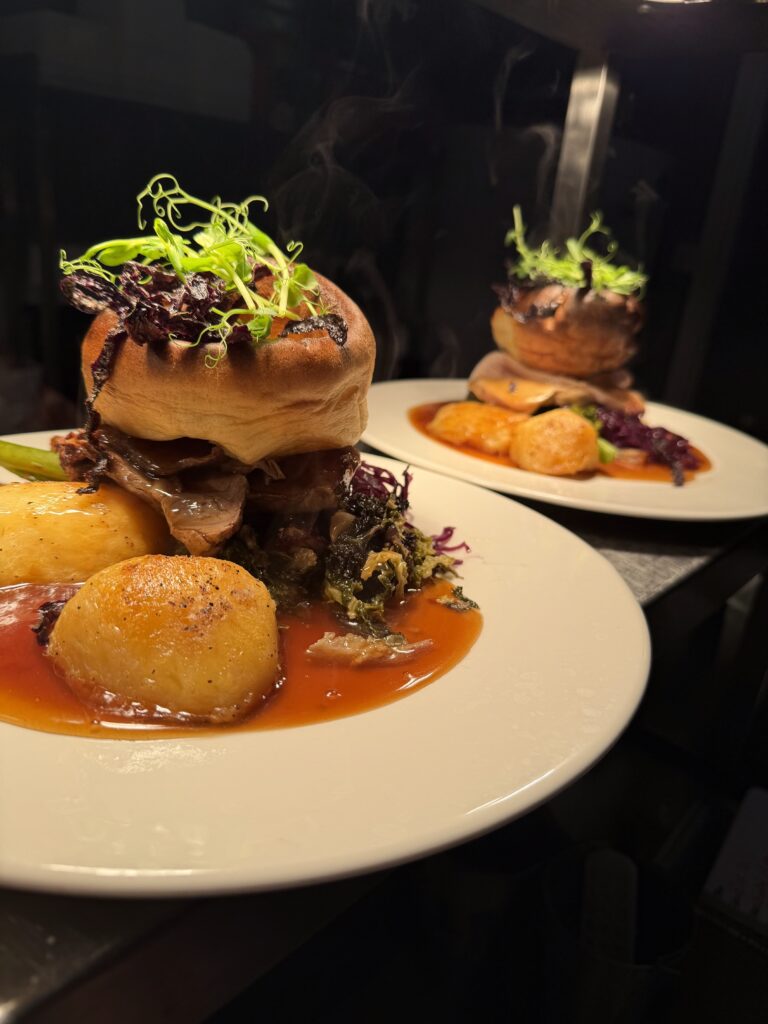 sunday roast - Carrot and Pee Shoots on top of Yorkshire Pudding